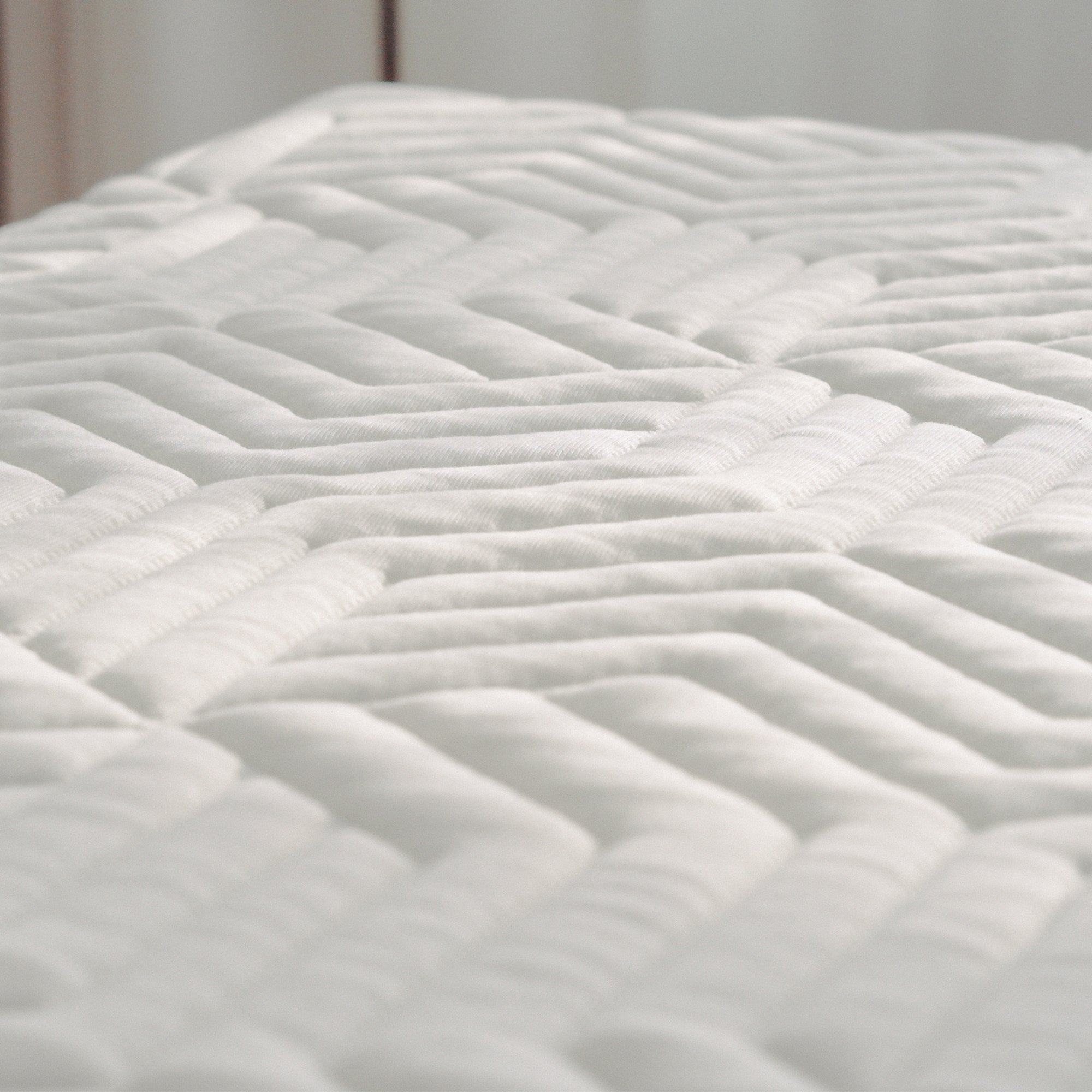 Slightly above shot of the Hybrid Mattress Ⅱ  - Medium to feature its textures, fabric, and design.