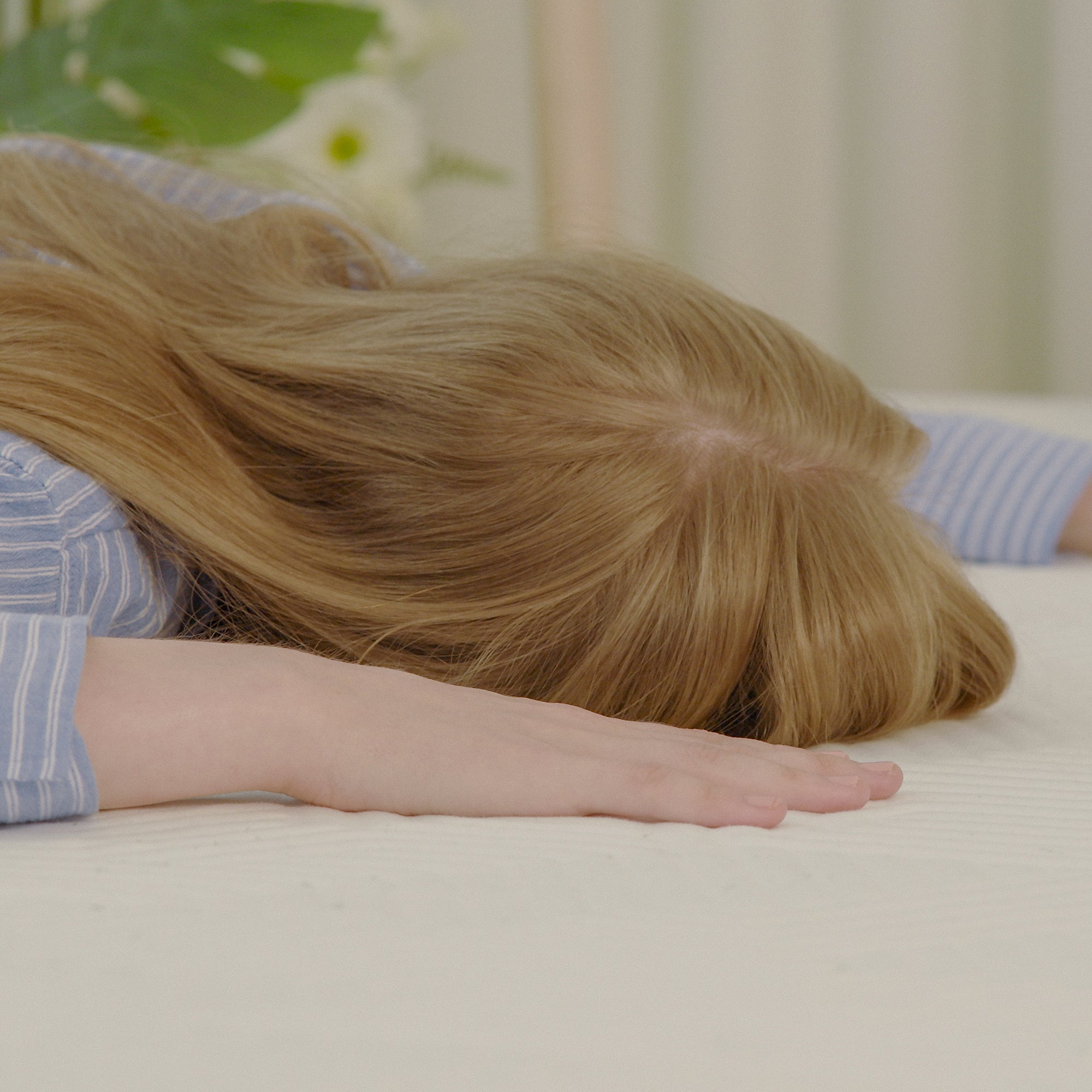 A woman lying face down on a Valmori Medium S-Shape Foam Mattress Ⅱ